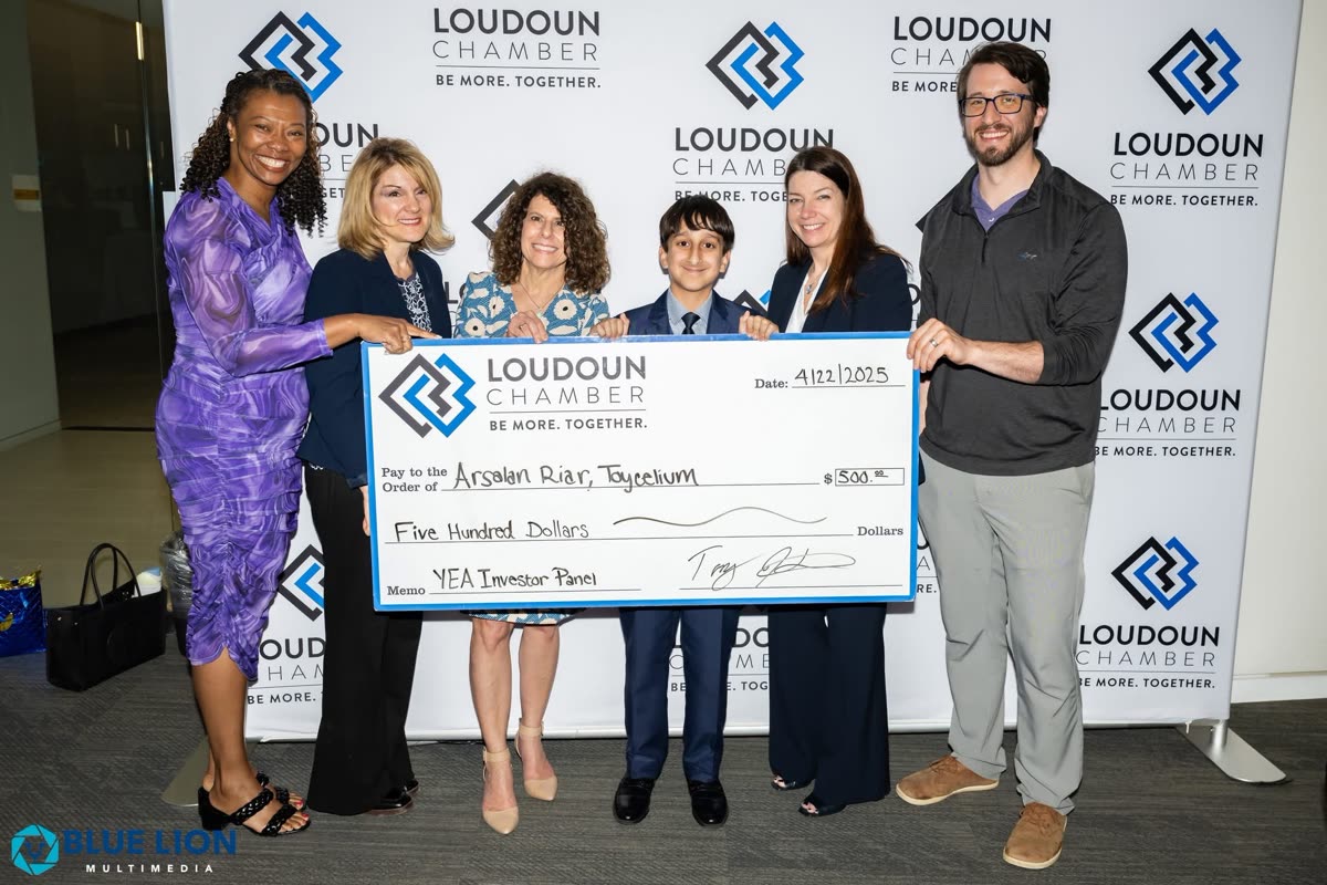 An Orblynx student receiving a $500 investment for the Toycelium venture at the Loudoun Chamber YEA Investor Panel