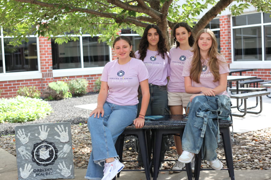 Orblynx students with a bench grown from regenerative materials